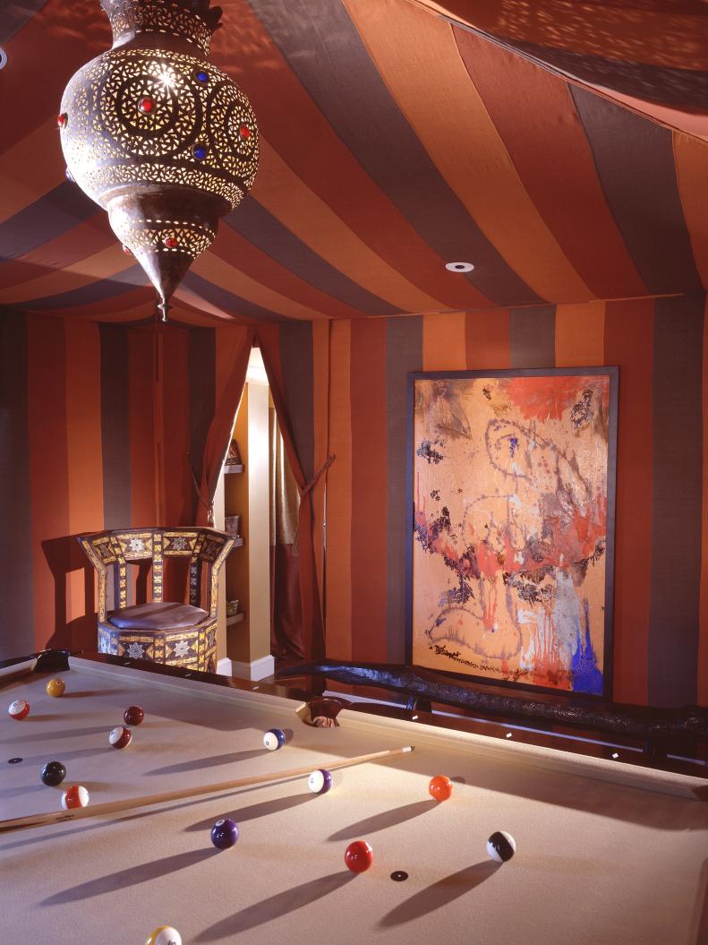Moroccan-Style Game Room With Draped Striped Ceiling Fabric