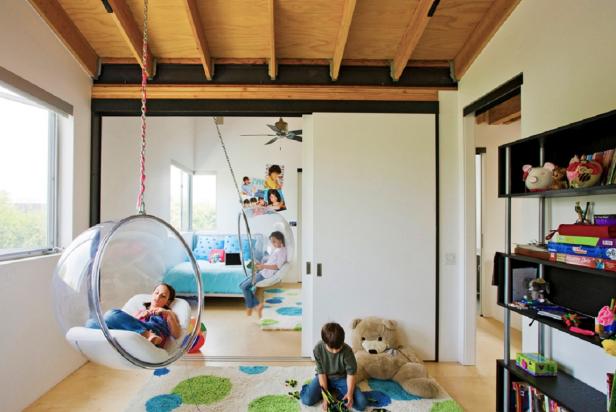 White Kid's Room With Exposed Ceiling Beams and Bubble Swings