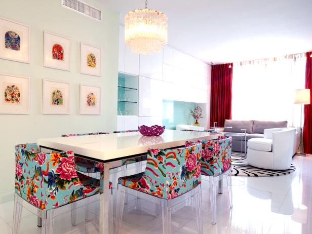 Open Dining Room With Bright Floral Chairs and White Dining Table