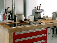 Red Cabinets And Wood Countertops in Small Industrial Style Kitchen