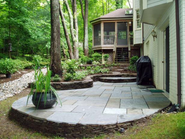 Traditional Flagstone Patio With Raised Flower Beds | HGTV