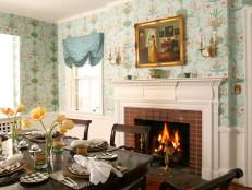 Wallpapered dining room with fireplace