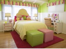 Pink and green bedroom with white bedding. 