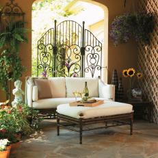 French Country Patio Photos Hgtv French Country Patio With Ornate Gate And Outdoor Sofa