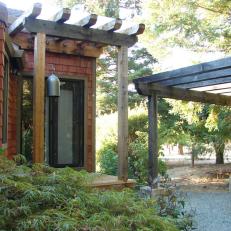 Home Entrance With Pergola and Asian Bell