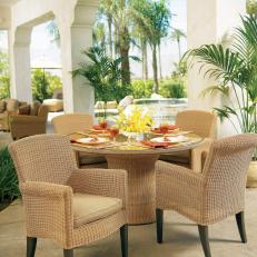 Tropical Outdoor Dining Area With Wicker Furnishings