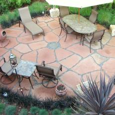 Round Flagstone Patio With Furniture and Dining Area