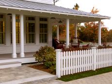 White Picket Fence in Front of White Front Porch 