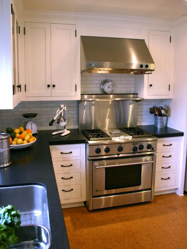 Traditional Kitchen With White Cabinets and Cork Floor