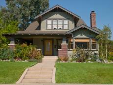 Sage Green Home Exterior With Yellow Front Door