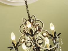Iron Chandelier with Cream Colored Ceiling Medallion