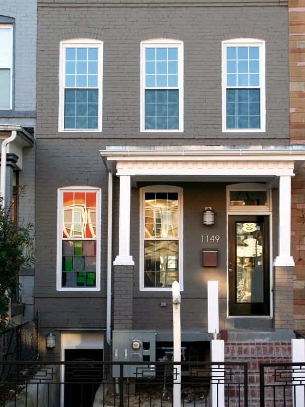 Townhouse With Gray Painted Brick and Small Front Porch