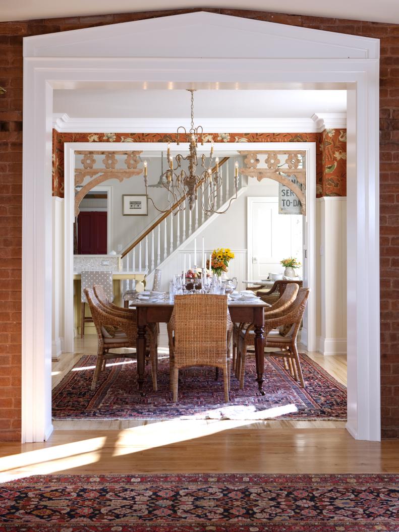 Dining Room with Brick Wall and Stylish Chandelier