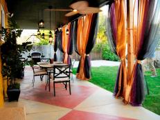 Patio With Curtains and Low-Hanging Lanterns 