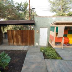 A Colorful Playhouse in a Contemporary Backyard