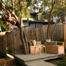 Fenced-In Backyard With Bench Seating