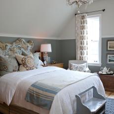 Gray French Country Bedroom With Chandelier and Floral Pillows 