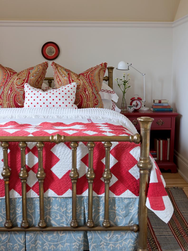 Red and White Cottage Bedroom With Brass Bed