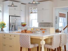 White Kitchen with Yellow Kitchen Island and Pendant Lights