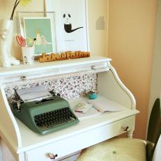 Small White Desk With Typewriter and Chair