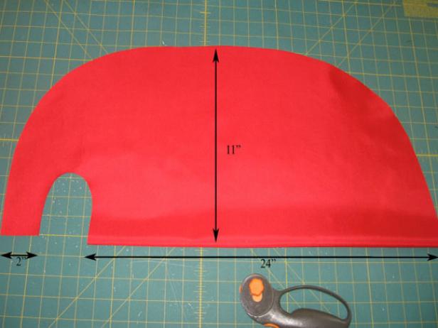 Red Fabric Being Measured for a Superhero Cape