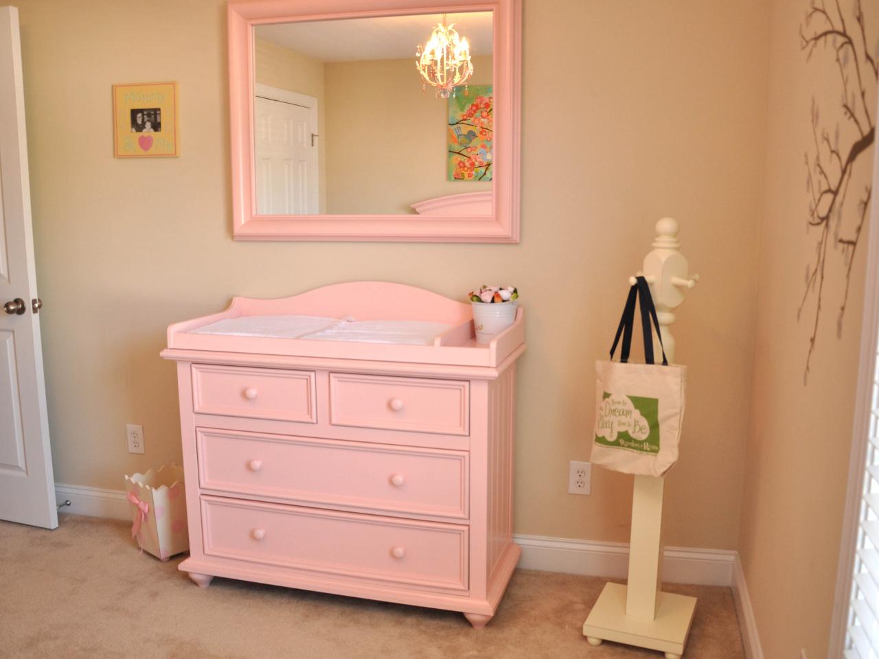 Girl S Nursery With Pink Changing Table And Mirror Hgtv