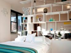 White Modern Bedroom With Open Wall of Cubicle Shelving