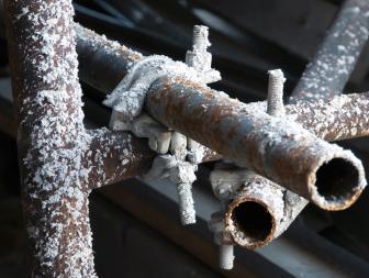 Cold water pipes covered in snow. 