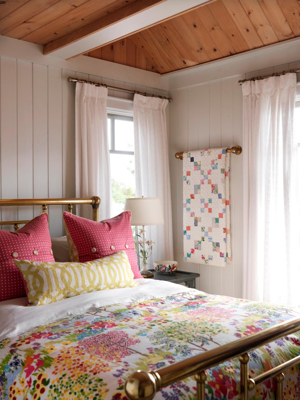 White Cottage Bedroom With Brass Bed And Colorful Bedding Hgtv