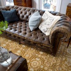 Tufted Leather Sofa With Persian Rug