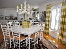 Open-Plan Kitchen With White Dining Table, Chairs and Chandelier