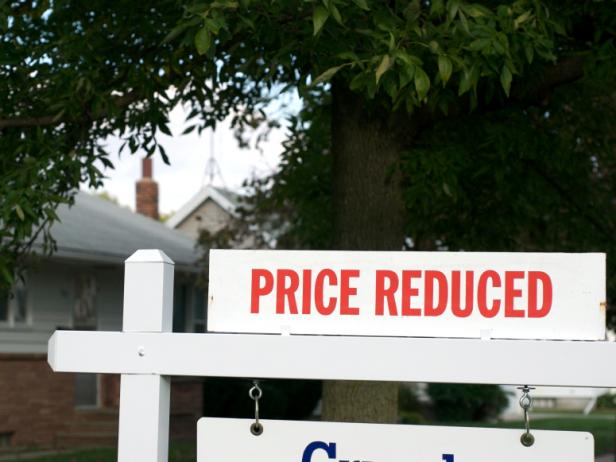 Real Estate Yard Sign Announces Price Reduced