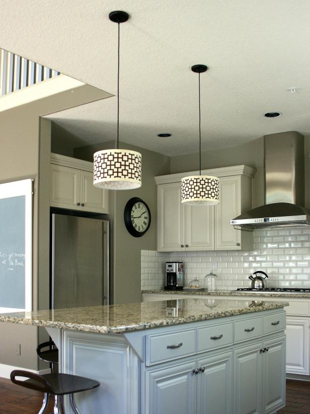 drum pendant lighting over kitchen island