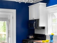 White Kitchen With Bright Blue Walls