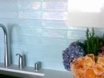 Blue-hued, iridescent glass tile backsplash for the kitchen.
