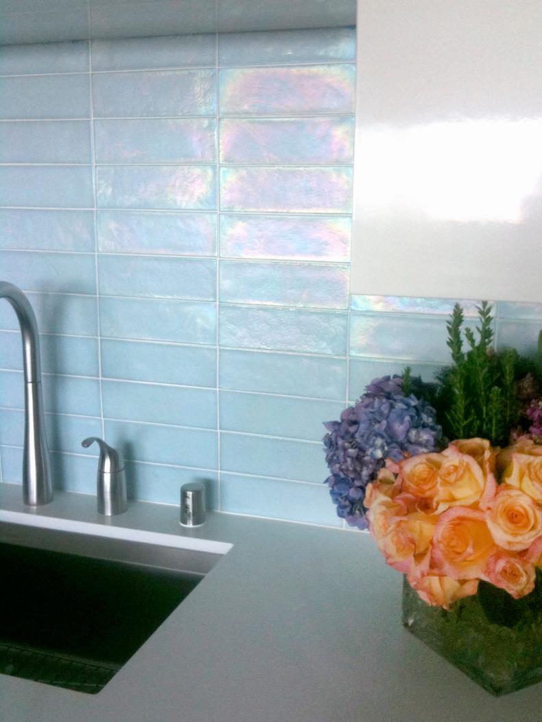 Blue-hued, iridescent glass tile backsplash for the kitchen.
