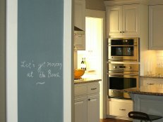 Kitchen With White Cabinets and Family Message Center 
