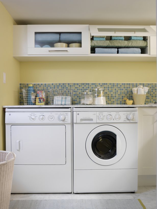 Yellow Laundry Room With Mosaic Tile