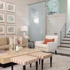 White Living Room With Striped Stools
