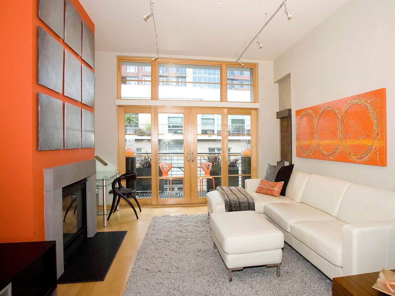 Contemporary Living Room With Orange Fireplace and Decor 
