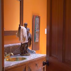 Grecian Statue Towel Holder in Orange Bathroom