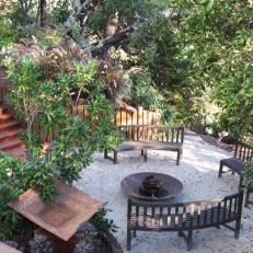 Round Fire Pit Surrounded by Curved Benches