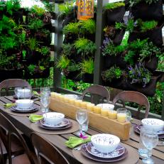 Outdoor Dining Room With Vertical Pocket Planter Walls