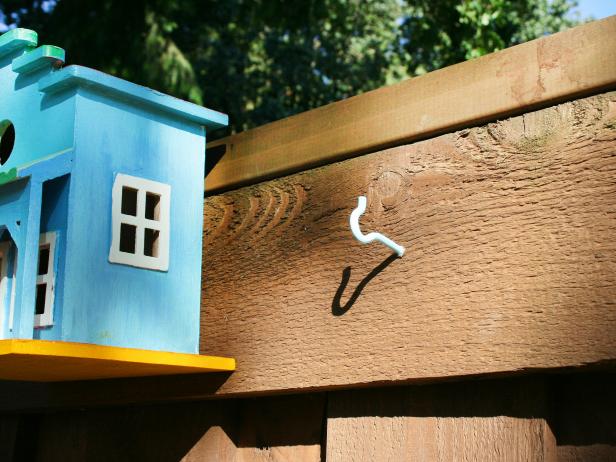 Painted Screw Hook on Fence for Hanging Birdhouses