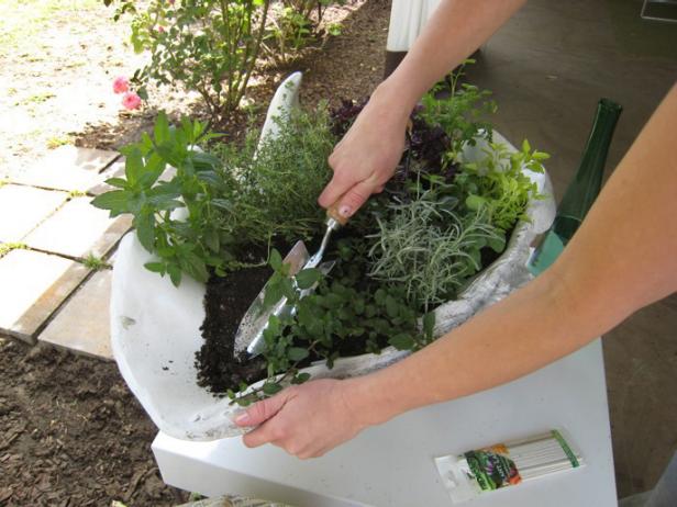 Packing Soil Into Container Garden