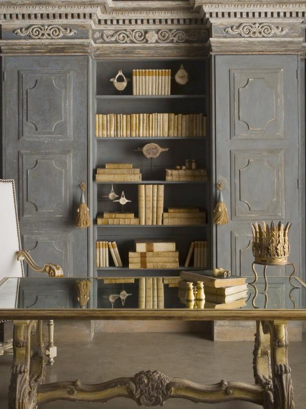 Elegant Gray Library With Built-In Bookcase, Table & Gold Accents