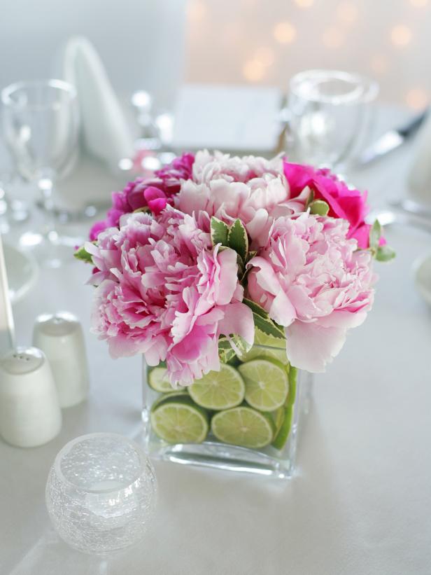 Pink Flowers and Sliced Limes in a square glass vase