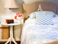 Light blue bedding and rustic headboard slipcover