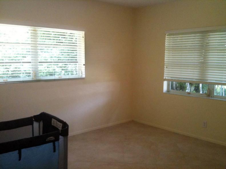 Windows with Blinds in a White Room 