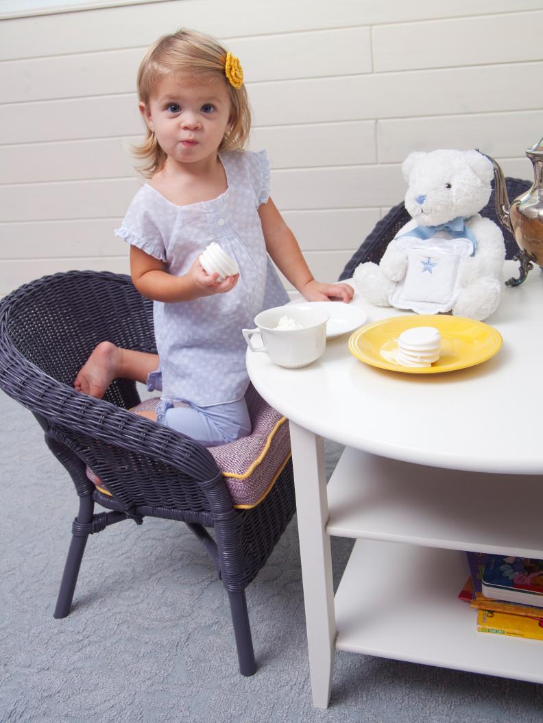 Little Girl Haing a Tea Party with Her Stuffed Bear 